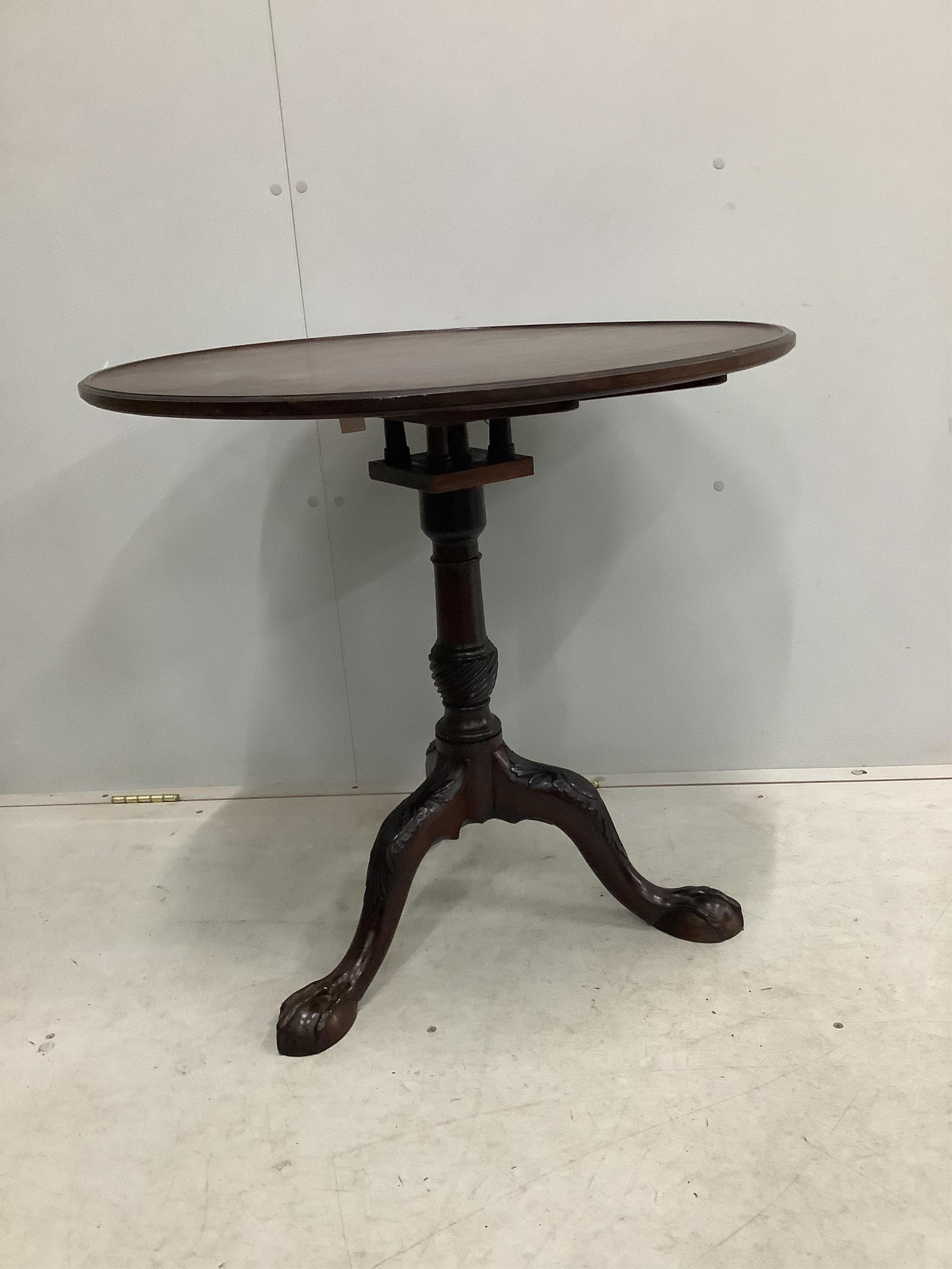 A George III circular mahogany tilt top birdcage tripod tea table, diameter 74cm, height 71cm. Condition - fair